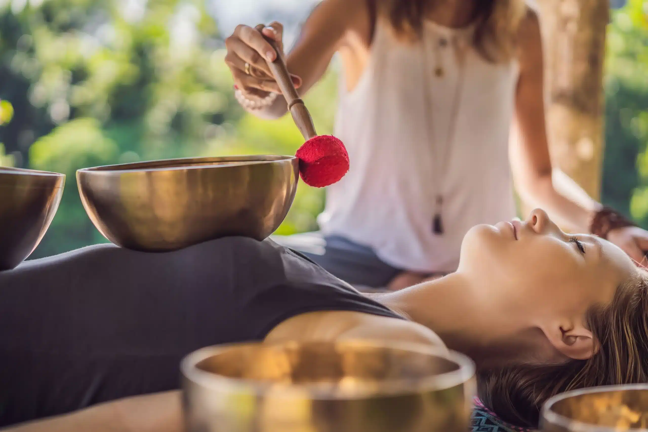 Young beautiful woman doing sound therapy at Well in Montclair in Montclair, New Jersey.